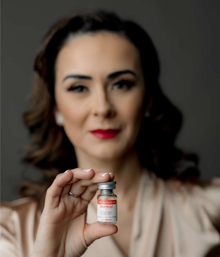juveau-botox Aesthetician carefully administering Botox injections to smooth lines around eyes.